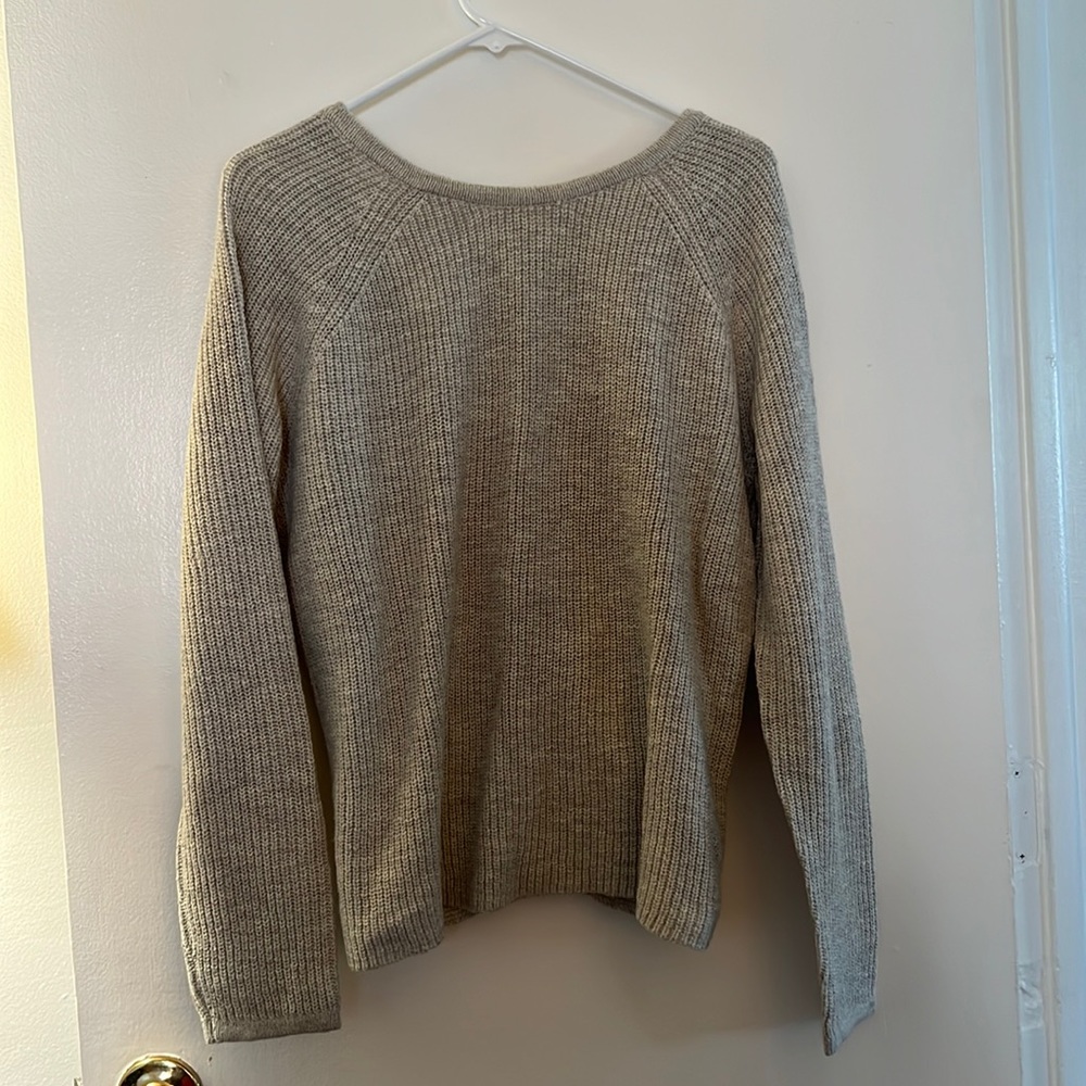 Arie grey sweater with open back, crisscross detail. Never worn. Size medium.